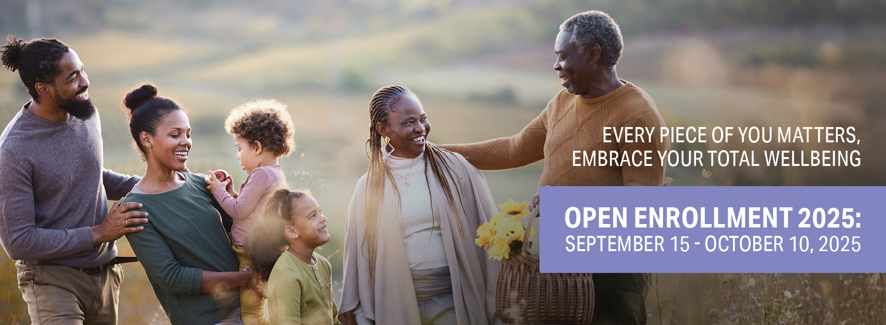 A smiling family outdoors, including two adults, two children, and two seniors, with text about open enrollment.