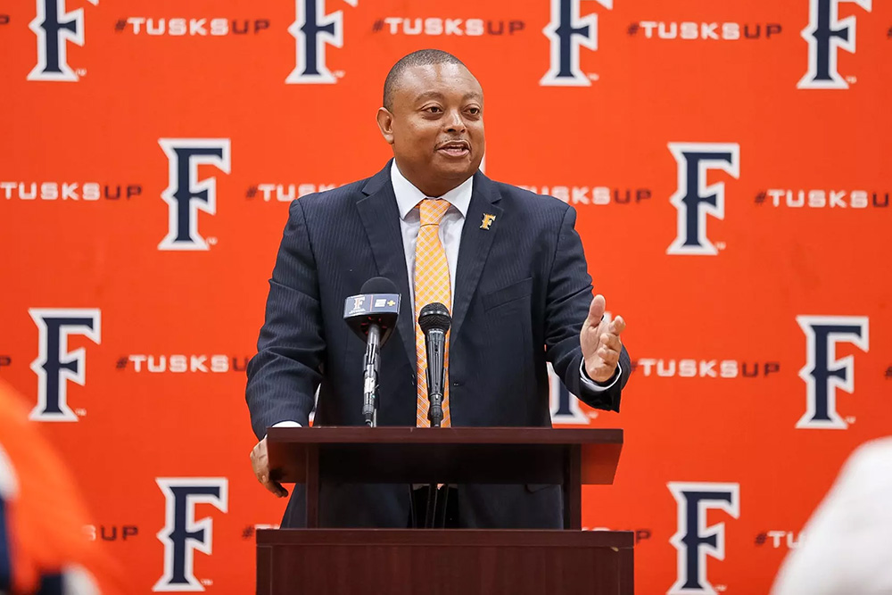 John Bonner, Head Women's Basketball Coach at the podium