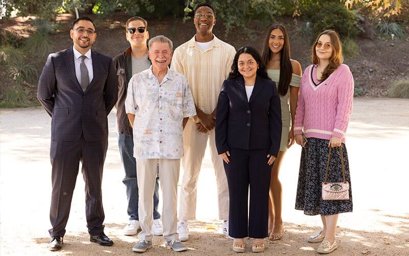 Student scholarship recipients Erik Dominguez, from back left, David Mortensen, Gregory Diamanti, Gigi Ferriera, Alina Chupikova and Samantha Brugman, front right, with Paul Miller, Emeriti Association president