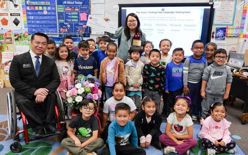 Teacher Megan Lee with a group of elementary school students.