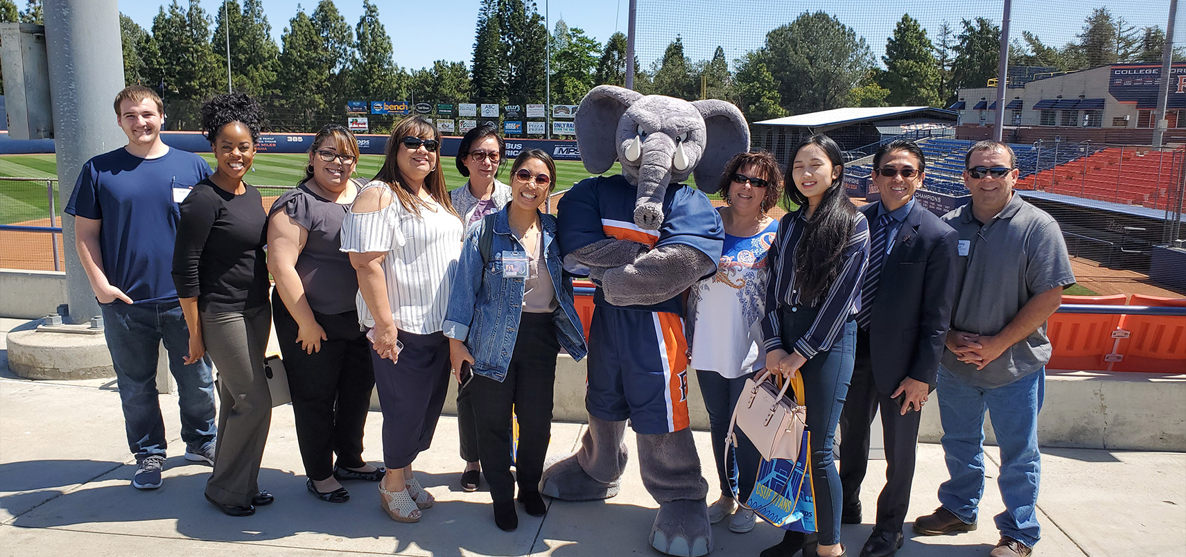 New employees standing with Tuffy