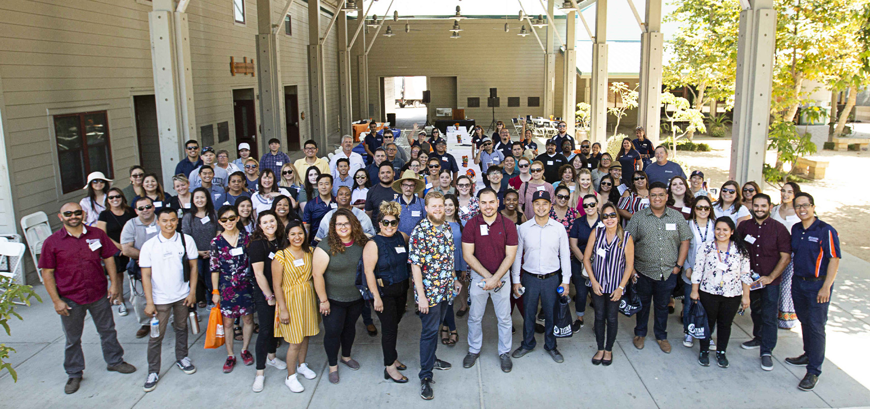 a large group of new employees at the annual new employee mixer