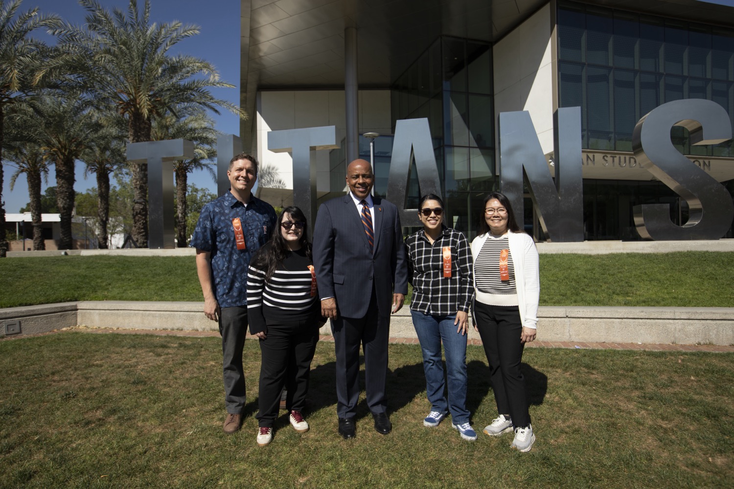 5 Years of Service honorees with President Rochon in front of the Titan Letters
