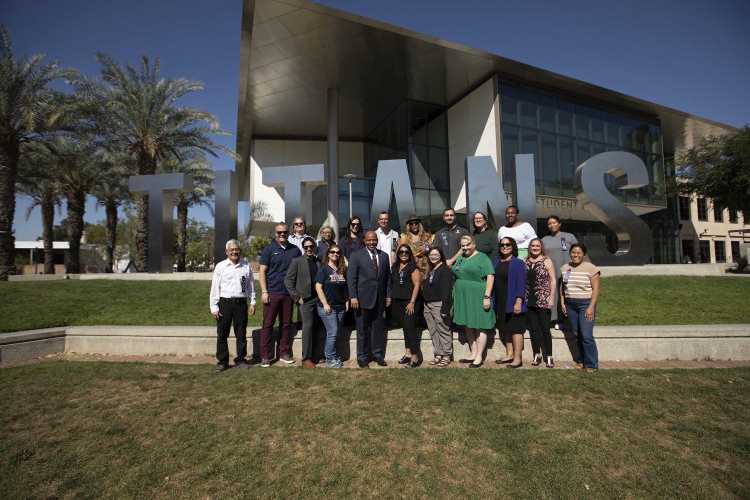 10 Years of Service honorees with President Rochon in front of the Titan Letters