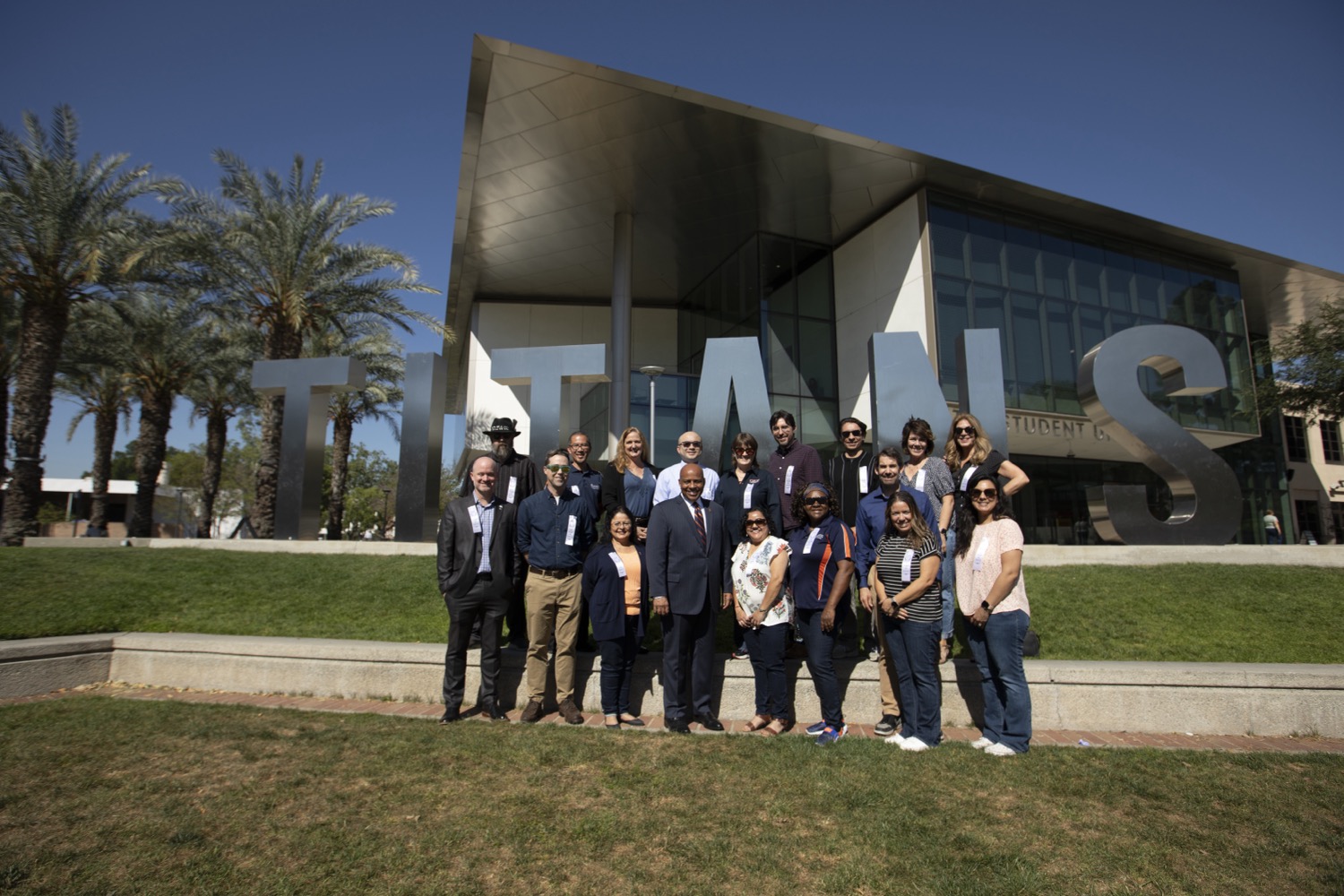 15 Years of Service honorees with President Rochon in front of the Titan Letters