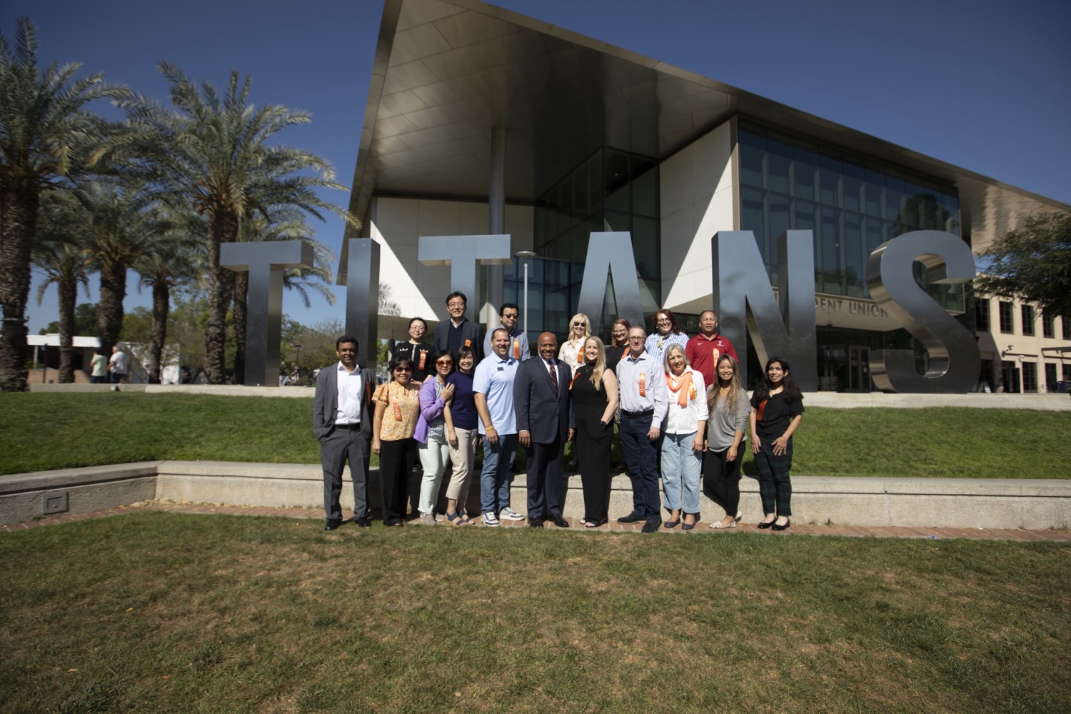 20 Years of Service honorees with President Rochon in front of the Titan Letters