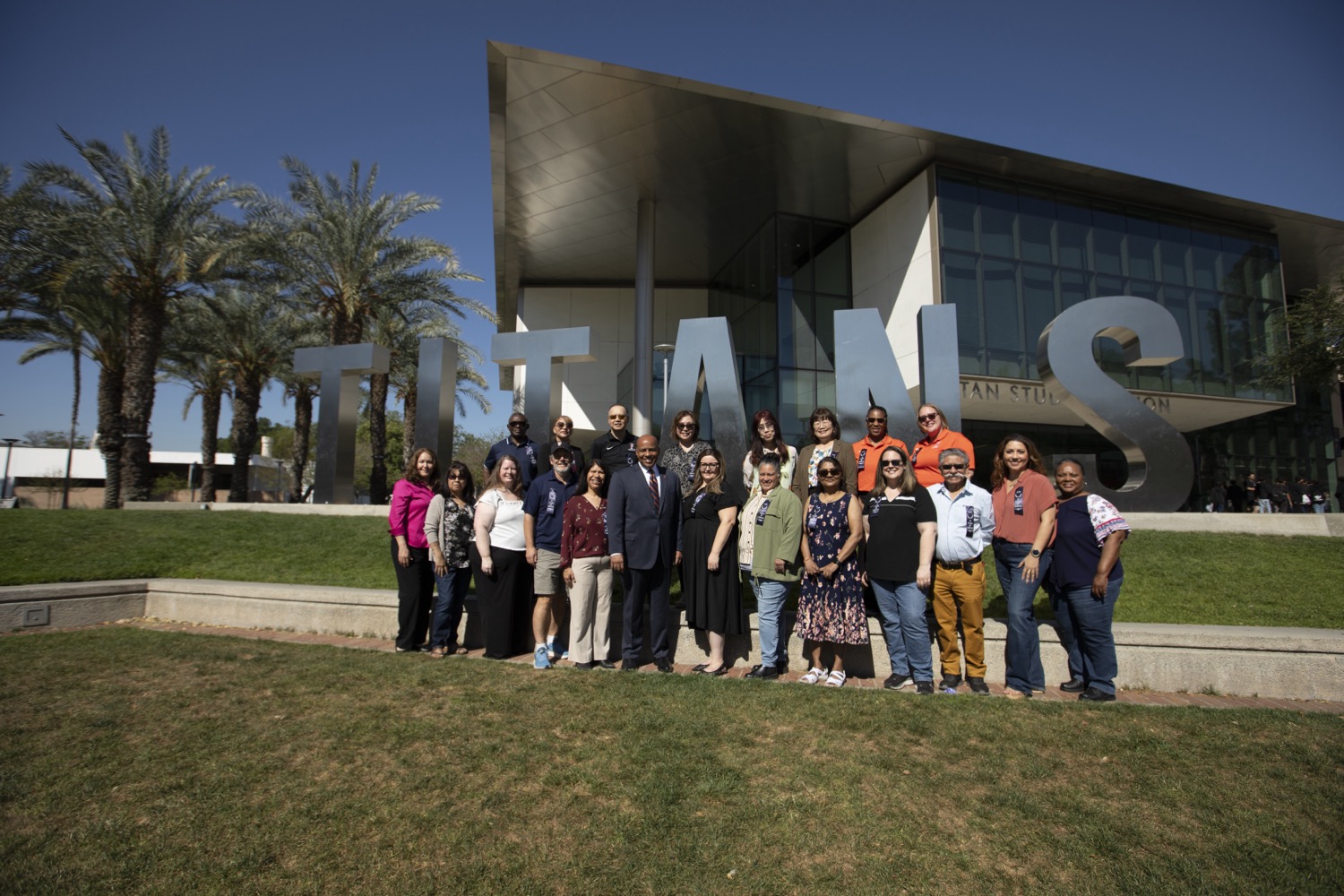 25 Years of Service honorees with President Rochon in front of the Titan Letters