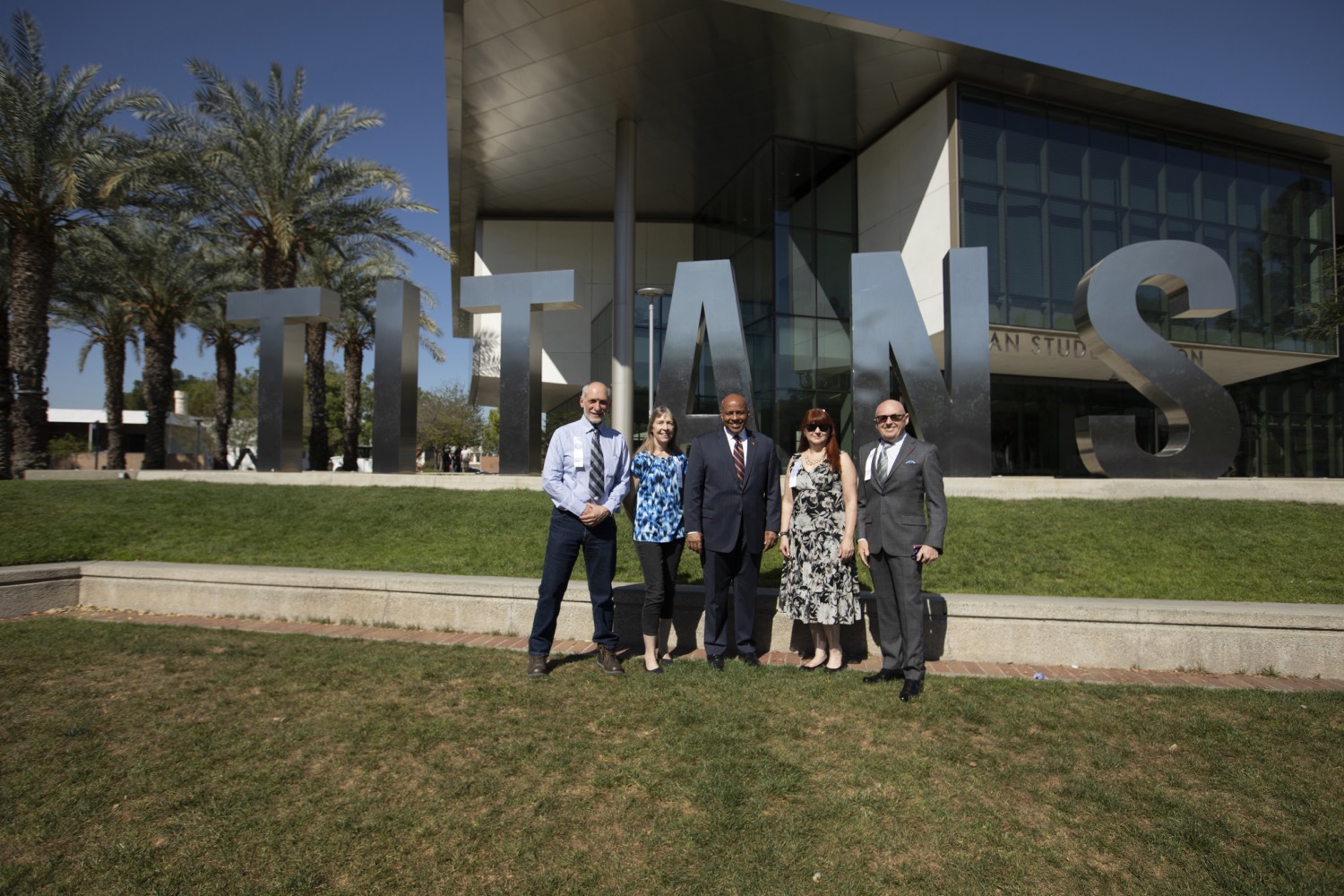 30 Years of Service honorees with President Rochon in front of the Titan Letters