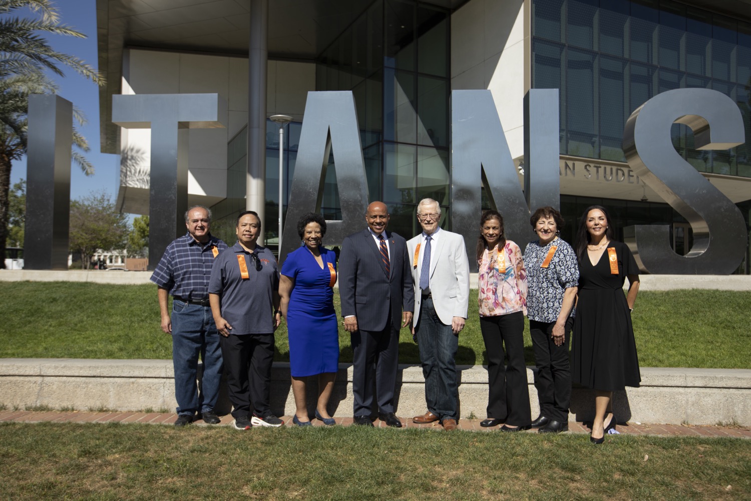 35 Years of Service honorees with President Rochon in front of the Titan Letters