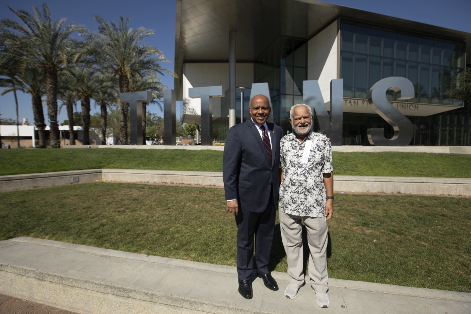 45 Years of Service honoree with President Rochon in front of the Titan Letters