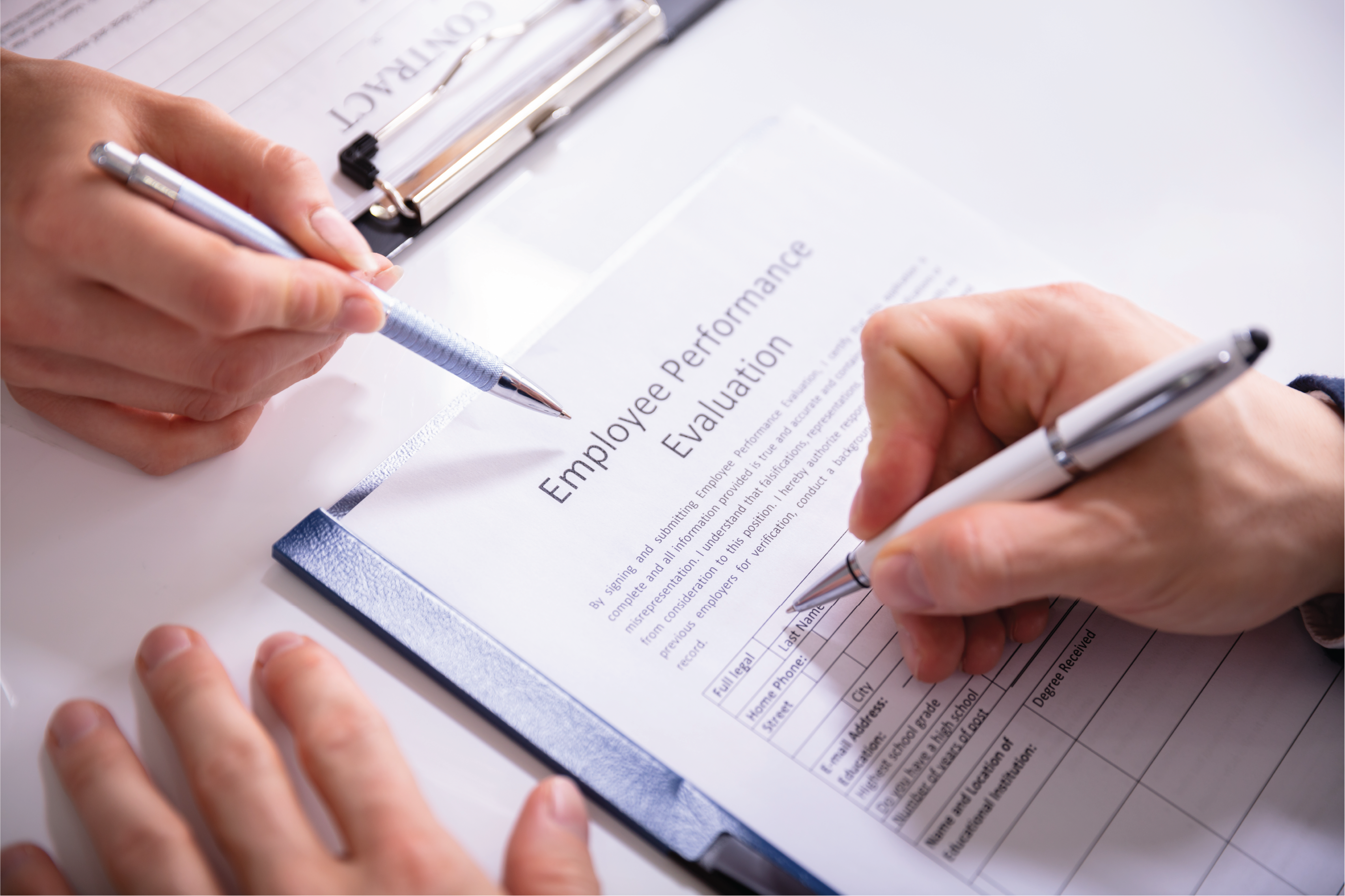 2 people filling out a worksheet