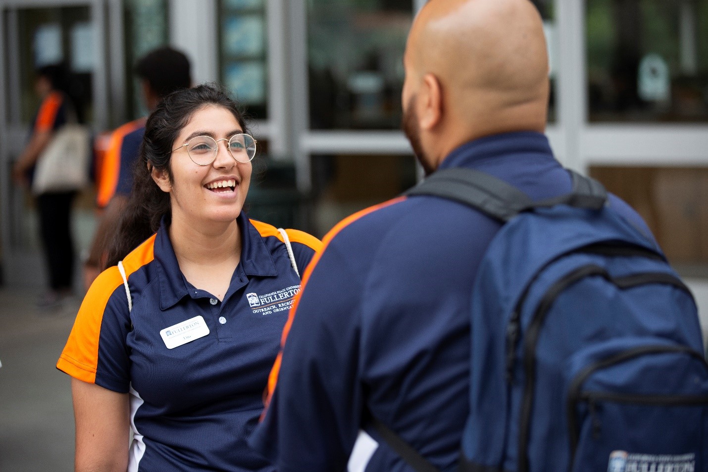 2 CSUF student assistant laughing with each other