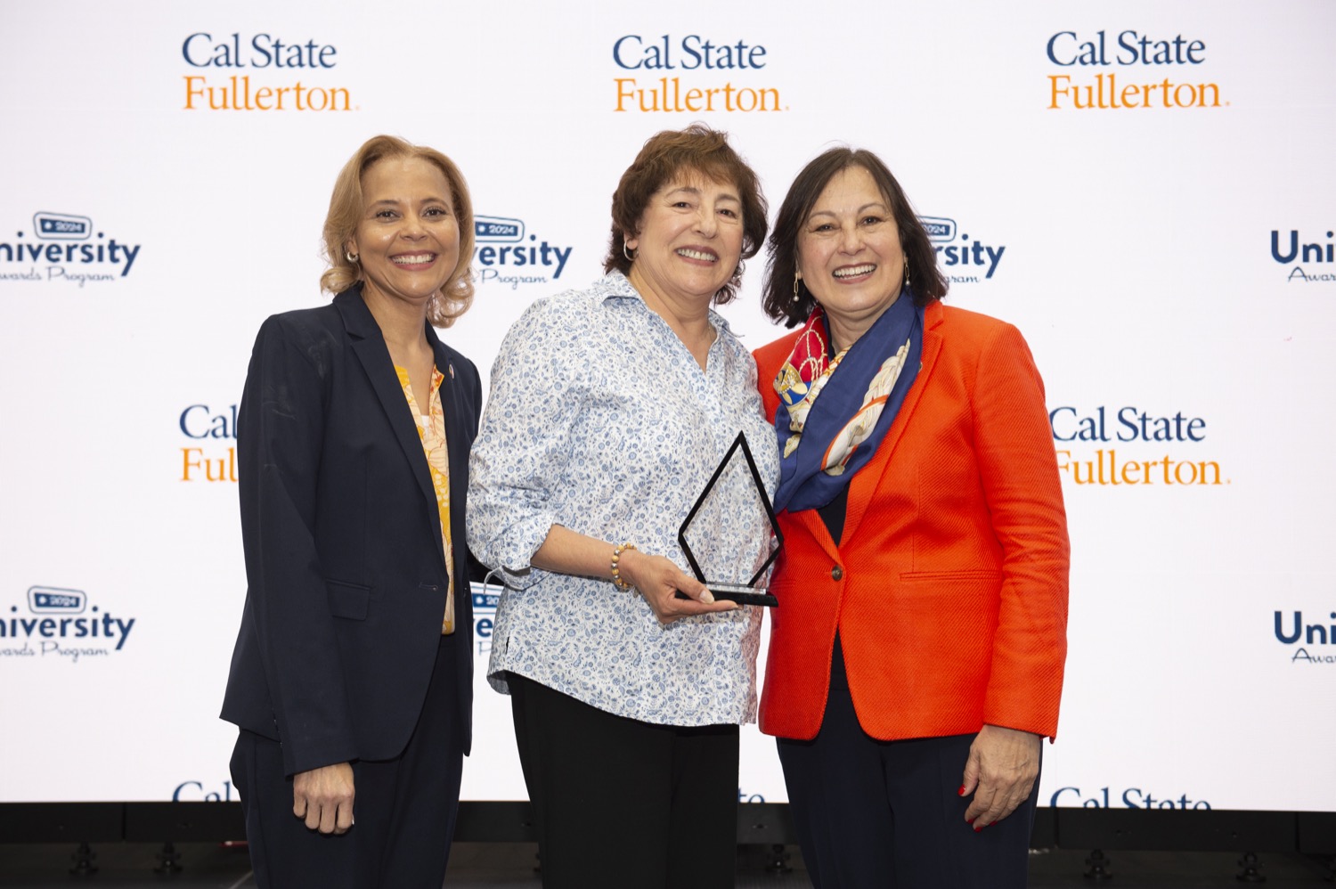 3 people - left: Phenicia McCullough, center: Totan Excellence Award Winner Elizabeth Morales, right: Presidet Alva