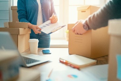 Person packs up boxes in an office