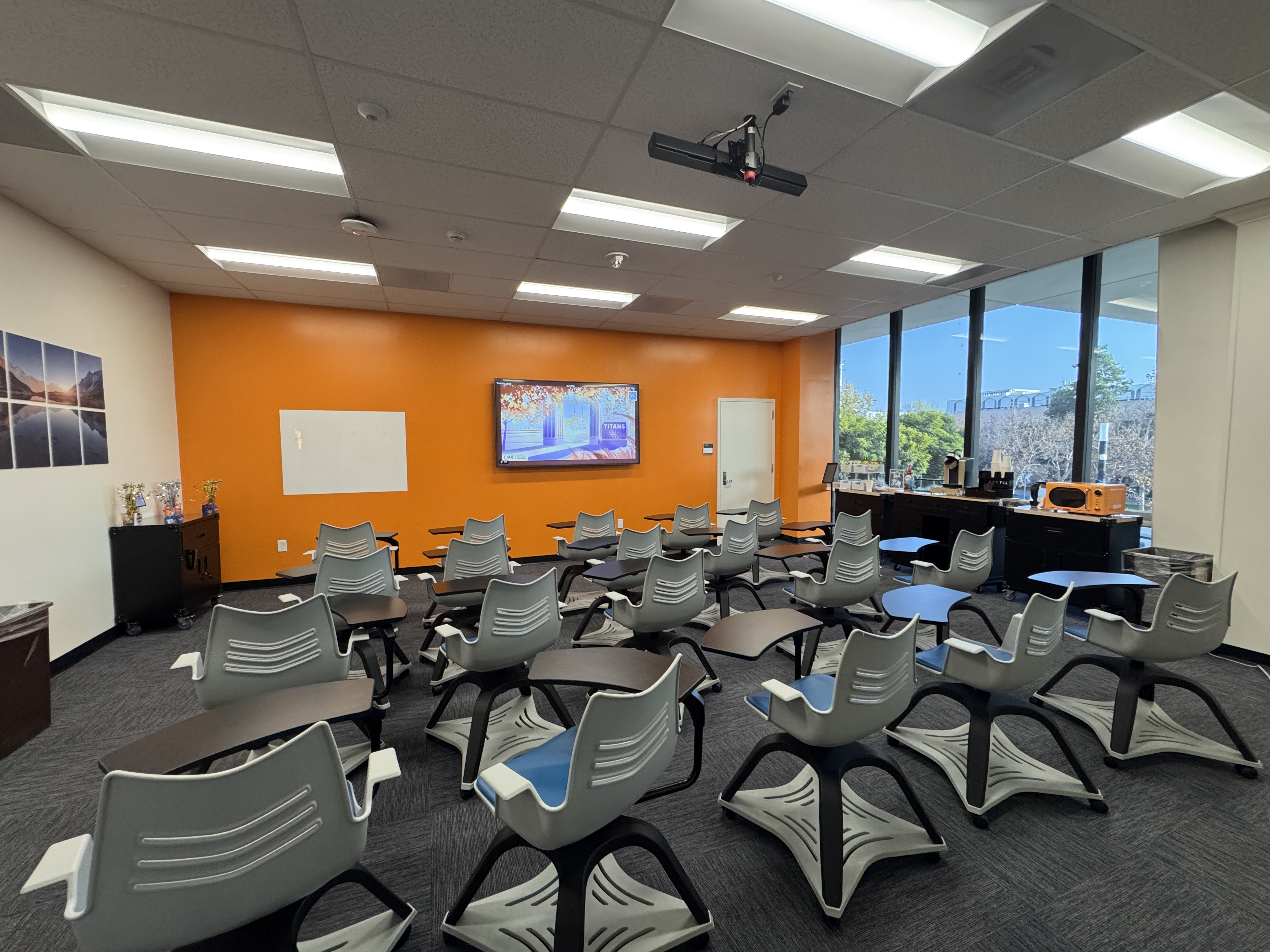 SDC training room with large television on the front wall and 20 chairs