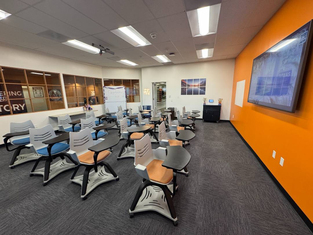 SDC training room with large television on the front wall and 20 chairs